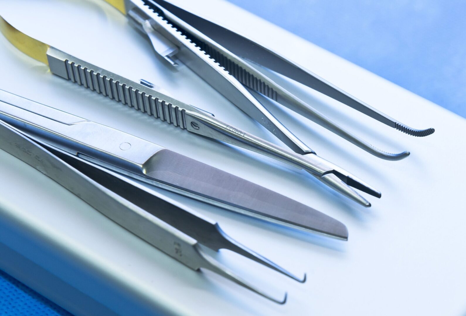 A close up of several different types of tweezers